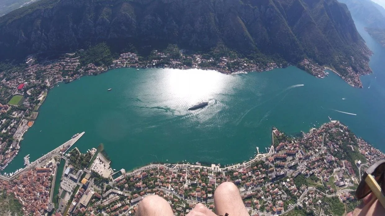 Bay of Kotor and Kotor Old Town seen from a tandem paragliding route.